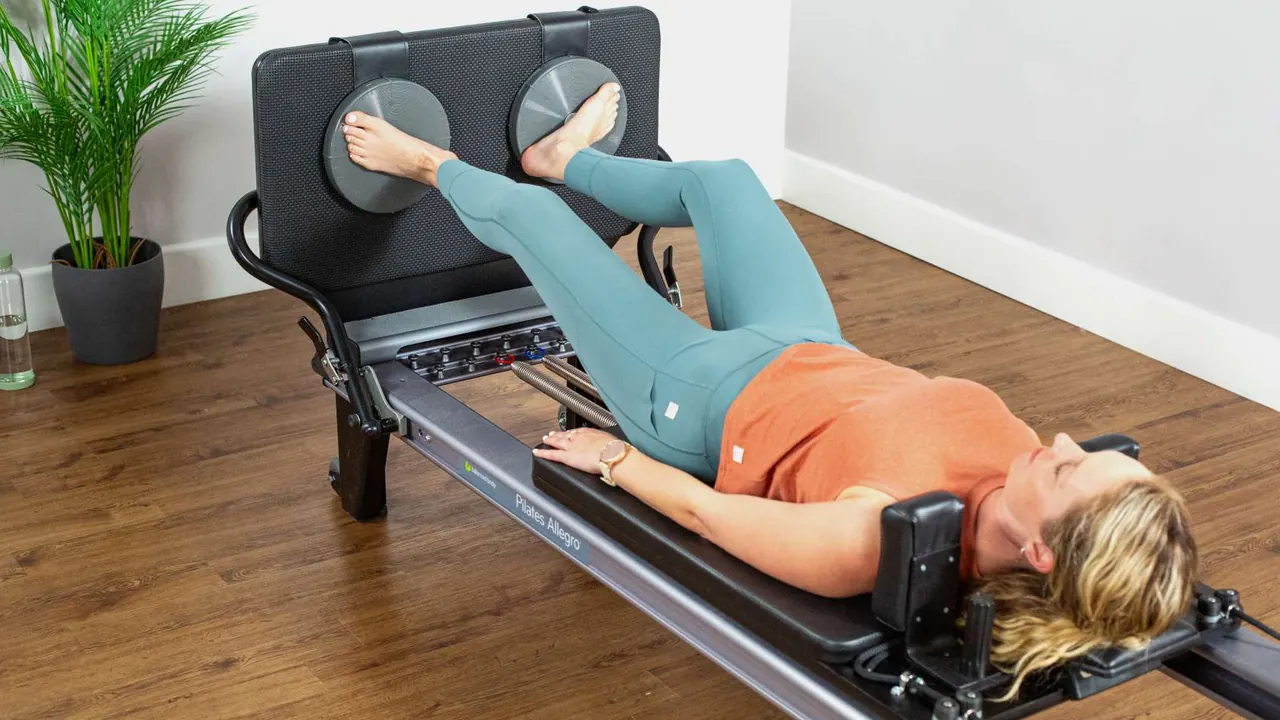 Discos rotatórios removíveis instalados em um jumpboard de Reformer